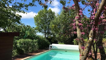 Seasonal outdoor pool, open 3:30 PM to 7:00 PM, pool umbrellas