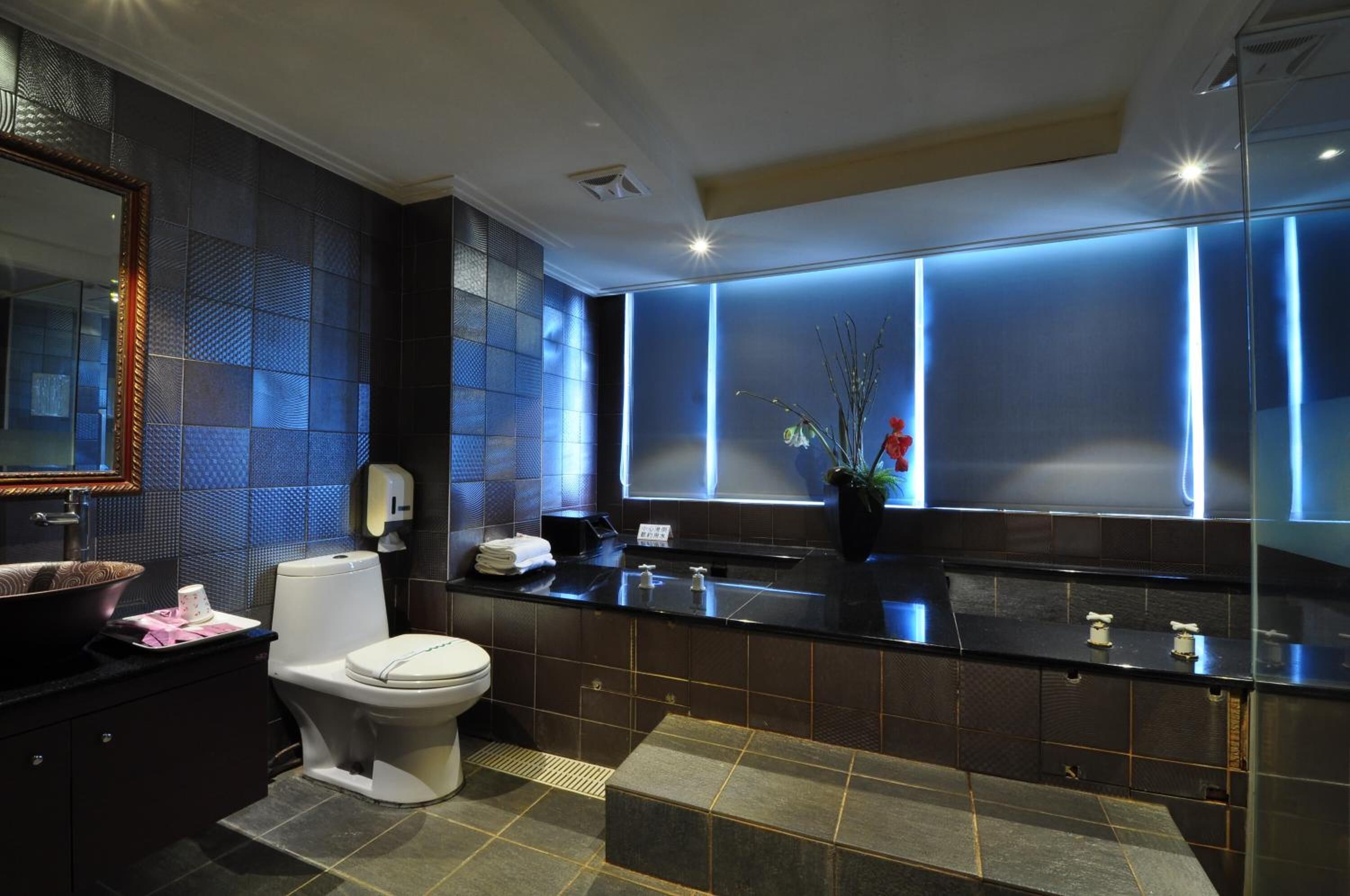 spring water bathtub, free toiletries, hair dryer, slippers