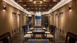 A conference room with a long table, chairs, and a chandelier. - Jinspa Resort Hotel (New Taipei City)