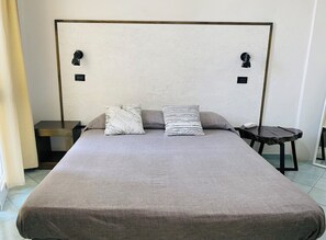 Standard Triple Room, Harbour View, Tower | Individually furnished, desk, laptop workspace, bed sheets - Black Market Hotel (Ischia)