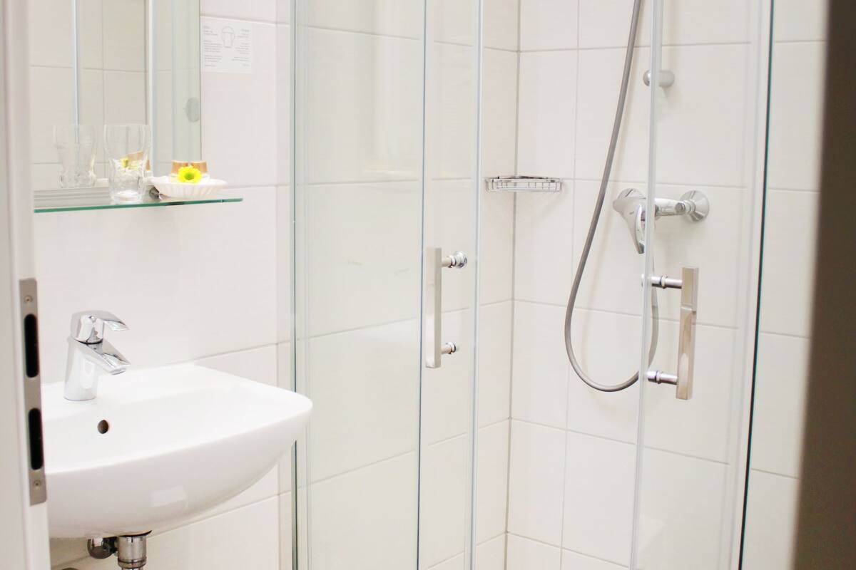 comfort single room | bathroom | shower, free toiletries, hair dryer, slippers