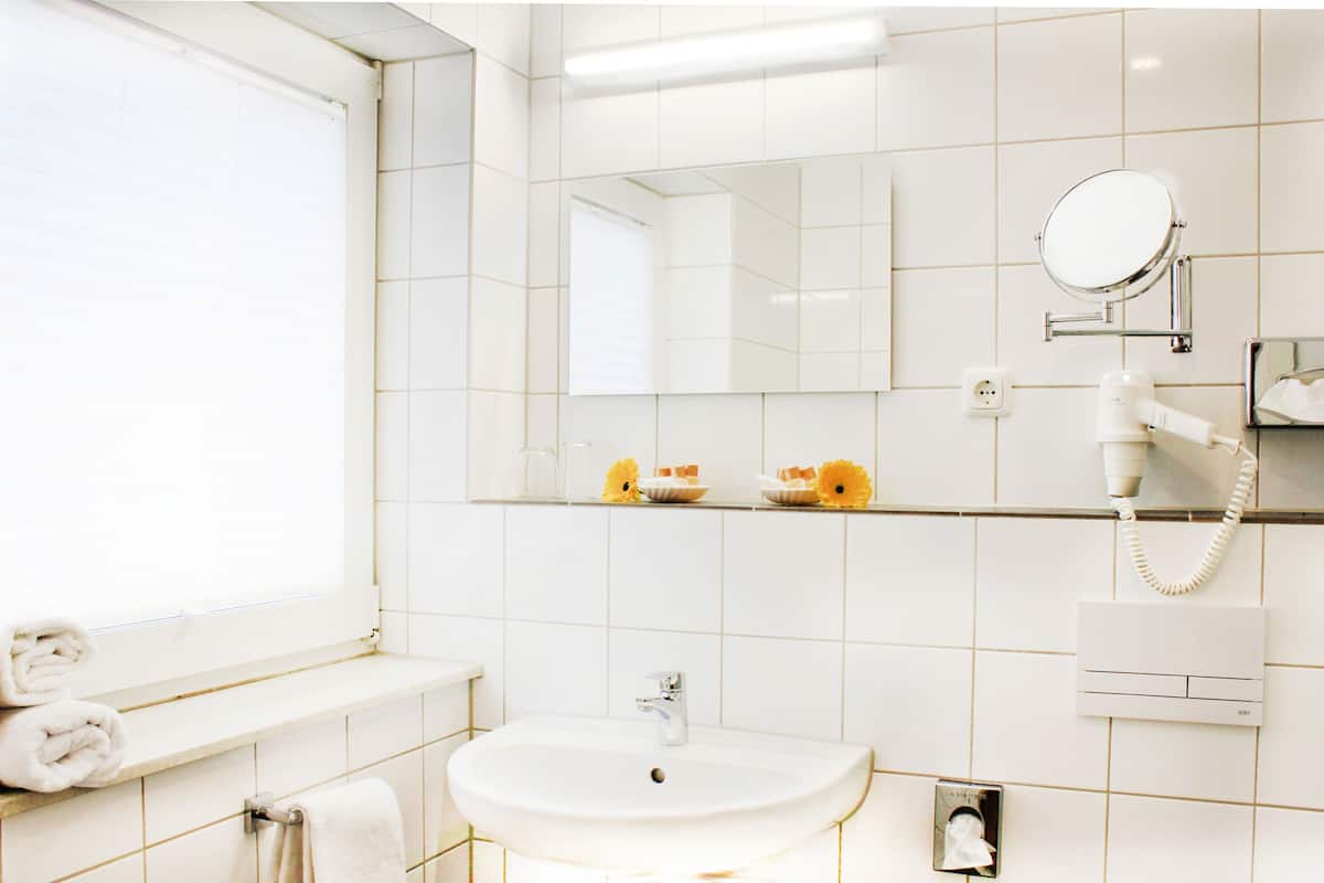 family room | bathroom | shower, free toiletries, hair dryer, slippers