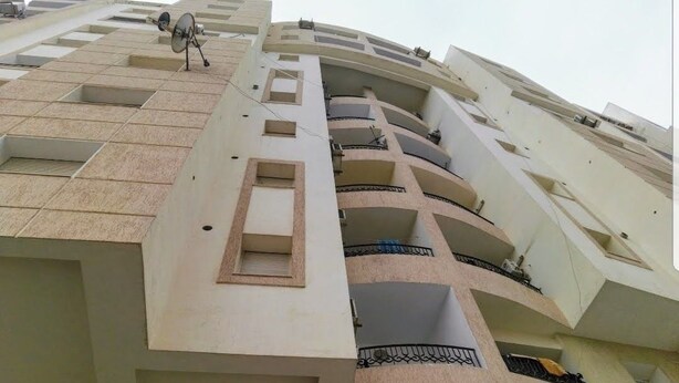 A multi-story building with balconies and satellite dishes. - El hana apartments (Kalaat El Andalous)