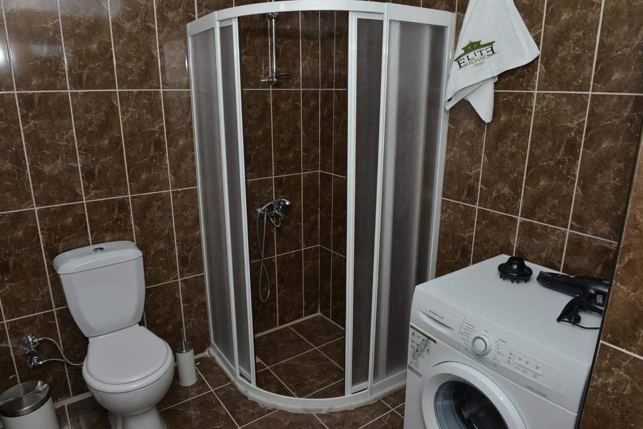 shower, rainfall showerhead, hair dryer, slippers