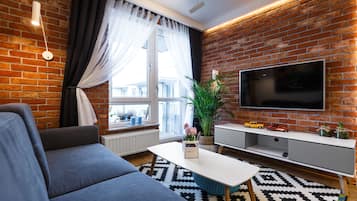 Apartment | Living area | 49-inch flat-screen TV with cable channels, TV