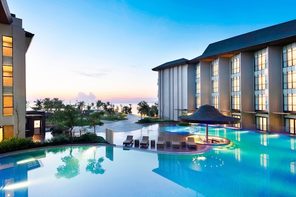2 outdoor pools, open 6 AM to 10:00 PM, pool umbrellas, sun loungers