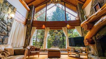 Deluxe Chalet, 5 Bedrooms, Mountain View | Living area | 55-inch LED TV with satellite channels, TV, fireplace