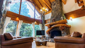 Deluxe Chalet, 5 Bedrooms, Mountain View | Living area | 55-inch LED TV with satellite channels, TV, fireplace