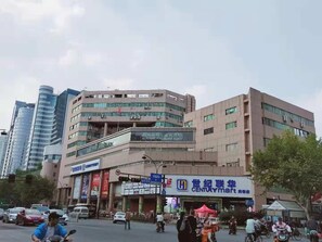 A multi-story building with a storefront on the ground floor.