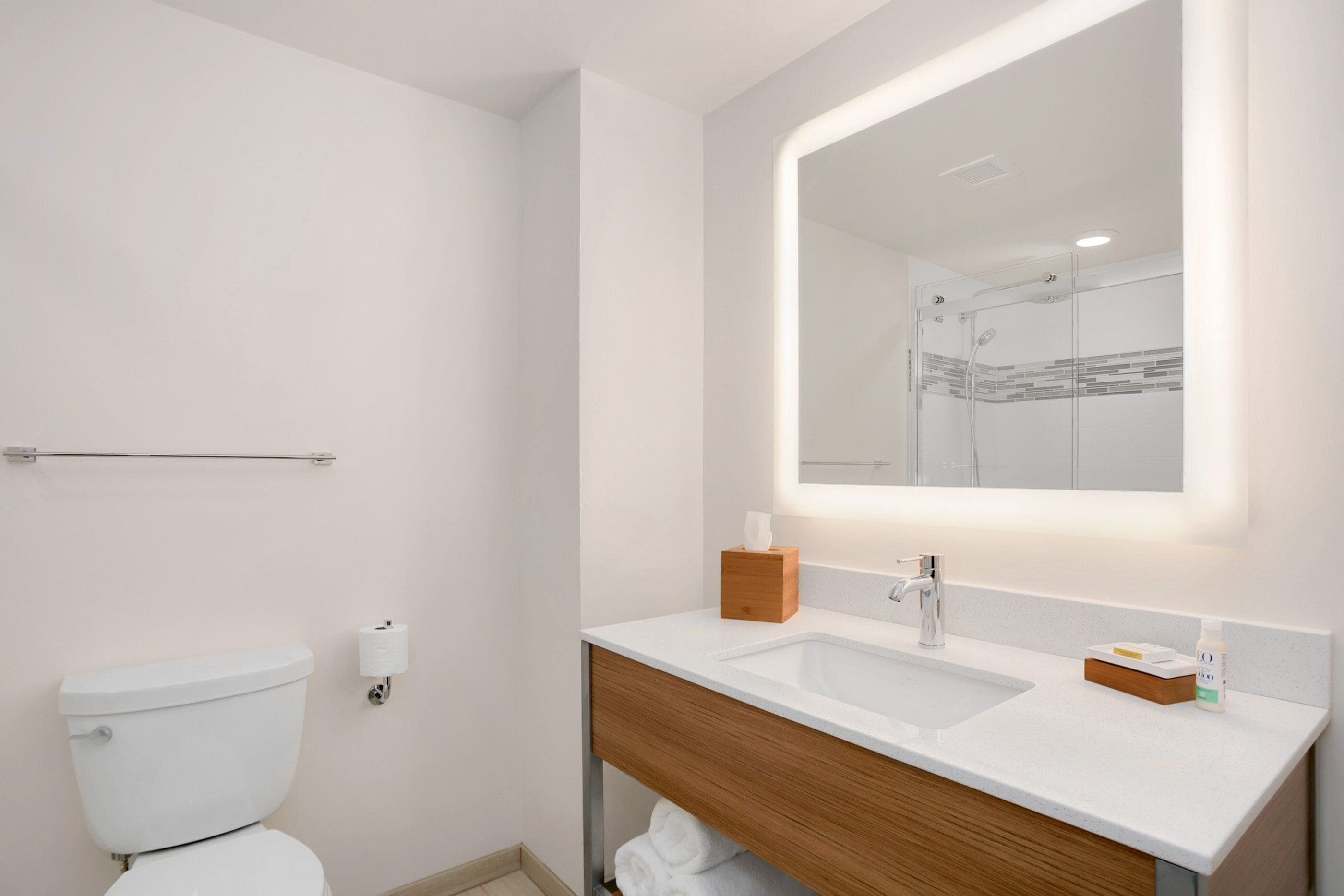 designer toiletries, hair dryer, towels, soap