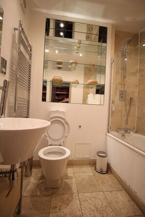 Combined shower/tub, hair dryer, towels, soap