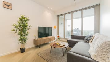 Deluxe Apartment, 2 Bedrooms, Balcony, Bay View | Living room | 55-inch flat-screen TV with cable channels, Smart TV