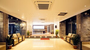 A modern lobby with a polished floor, seating areas, and a reception desk. - The Cox Beach Resort (Cox's Bazar)