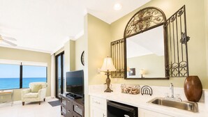 A modern kitchen with a built-in dishwasher, a large window overlooking the sea, and a dining area with a view. - Pier!! Use a private fishing pier!  Direct Gulf View - Pool (Orange Beach)