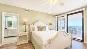 A bedroom with a bed, nightstands, a ceiling fan, a balcony with a view. - Pier!! Use a private fishing pier!  Direct Gulf View - Pool (Orange Beach)