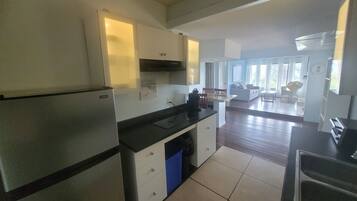 Fridge, microwave, stovetop, coffee/tea maker