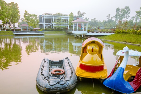 A water body with boats and a gazebo.