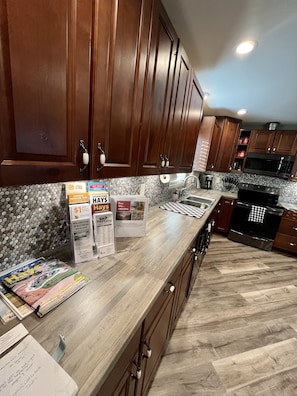 Fridge, microwave, oven, stovetop - Stay in historic downtown Hays in upscale accommodations (Hays)