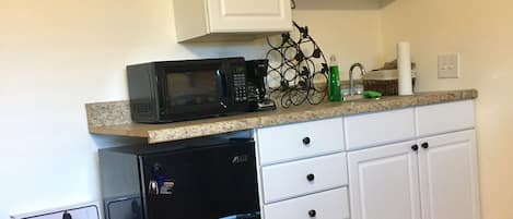 Fridge, microwave, coffee/tea maker, toaster