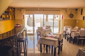 Breakfast, lunch served; local and international cuisine, pool views