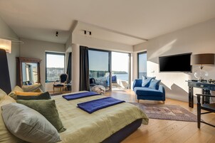 Suite Deluxe, vistas al mar | Ropa de cama de alta calidad y edredones de plumas