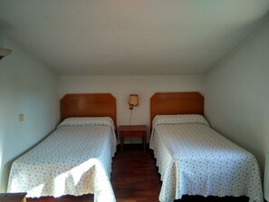 Quarto triplo | Camas extras/dobráveis (sobretaxa), roupa de cama