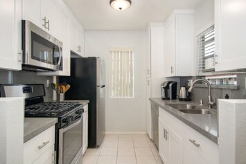 Newly remolded, fully stocked kitchen.