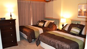A hotel room with two beds, a dresser, a ceiling fan, and a framed picture on the wall. - 'Silvercreek Escape' 2BR Silvercreek, Ski-in/Ski-out!!!!!           (Snowshoe)