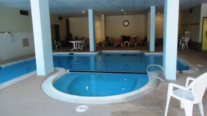 An indoor swimming pool with a hot tub, surrounded by white chairs and tables. - 'Silvercreek Escape' 2BR Silvercreek, Ski-in/Ski-out!!!!!           (Snowshoe)