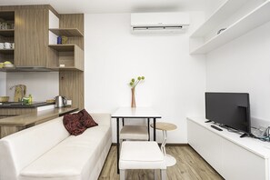 Standard Studio | Living area | 32-inch flat-screen TV with cable channels, TV - Treetops Condo (Pattaya)