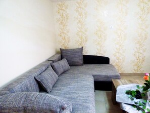 Luxury Condo, 1 Bedroom | Living room | Flat-screen TV