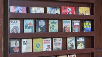 A bookshelf with various books.