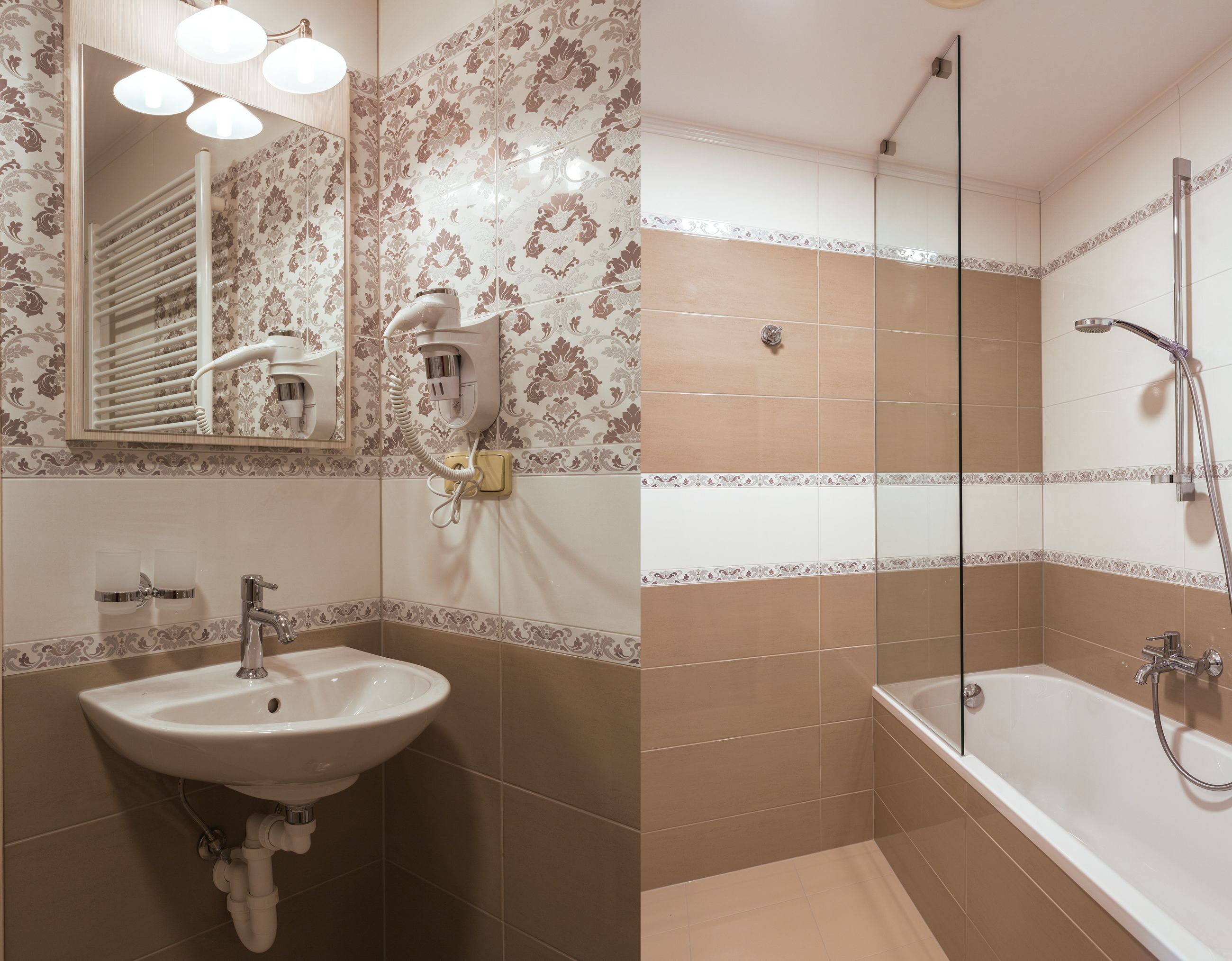 A bathroom with a sink, mirror, and shower.