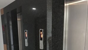 An elevator with digital displays indicating floor numbers 5 and 8. - Rocco Hua Hin 512 Condominium (Hua Hin)