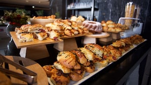A buffet with various baked goods including bread rolls, pastries, and desserts. - ibis Styles Istanbul Bomonti (Istanbul)