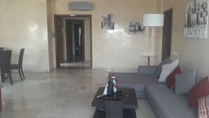 Apartment, 3 Bedrooms | Living area | 32-inch flat-screen TV with satellite channels, TV - Appartement JJL (Agadir)