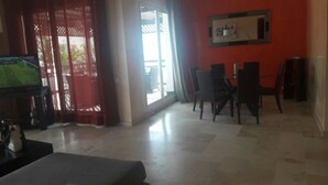 Apartment, 3 Bedrooms | Living area | 32-inch flat-screen TV with satellite channels, TV - Appartement JJL (Agadir)