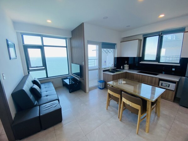 Deluxe Apartment, 2 Bedrooms, Kitchen | Living area | 42-inch flat-screen TV with digital channels, TV