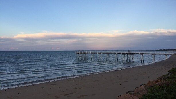 A beach with a pier extending into the water. - Holiday at Hillcrest (Scarness)