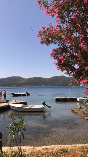 On the beach, sun-loungers