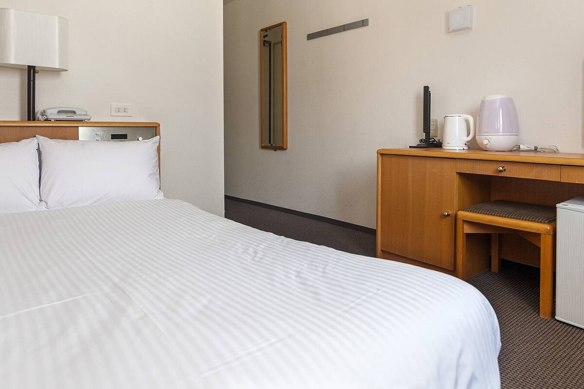 Desk, blackout curtains, iron/ironing board (on request), free WiFi