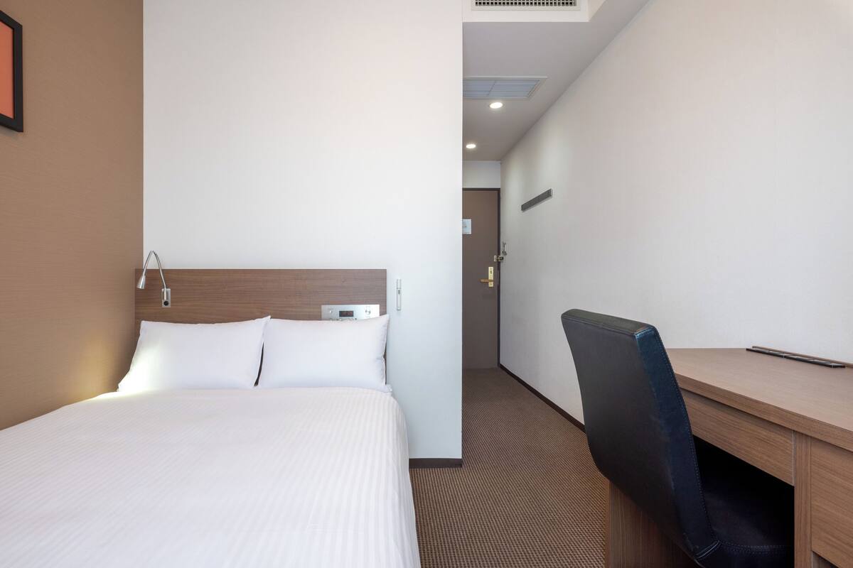 Desk, blackout curtains, iron/ironing board (on request), free WiFi