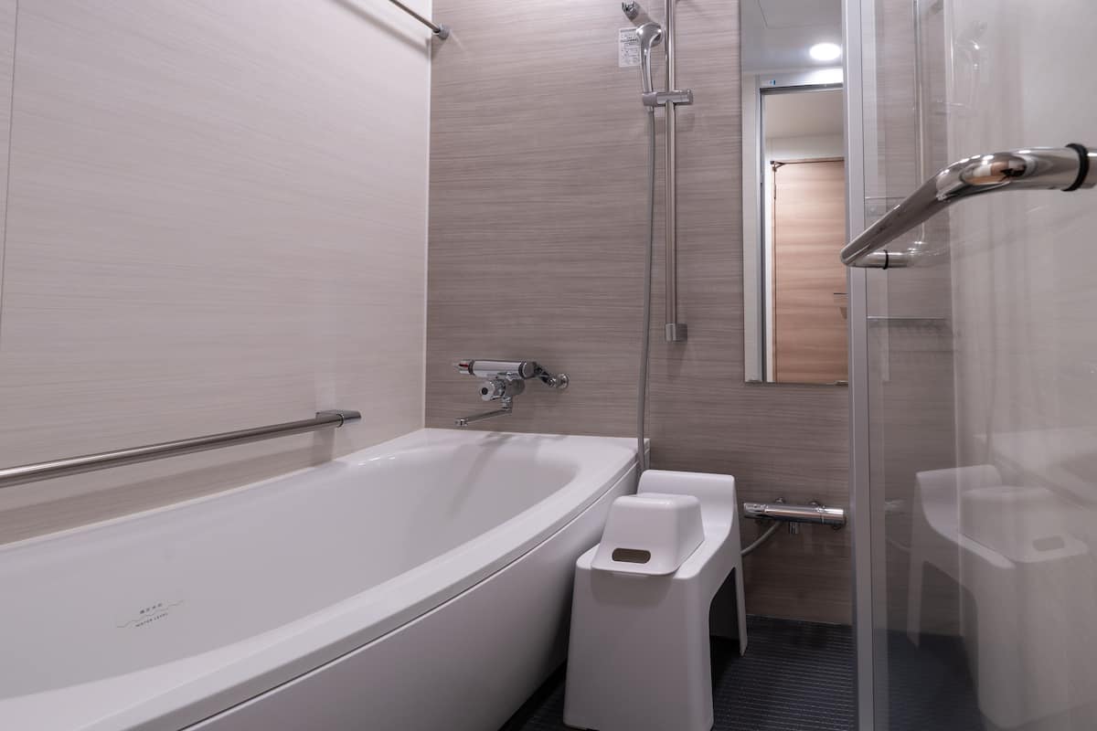 separate bathtub and shower, deep-soaking bathtub, free toiletries