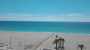 On the beach, sun-loungers