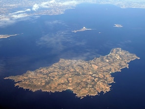 An aerial view of a coastal area with a mix of urban and rural landscapes, including fields and small settlements. - New house in Bangor, close to the beach, well-decorated (Bangor)