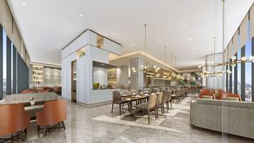 Un moderno vestíbulo de hotel con zona de comedor, arreglos de asientos y vistas a la ciudad.
