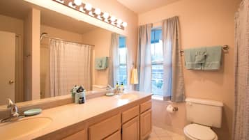 Bathtub, hair dryer, towels