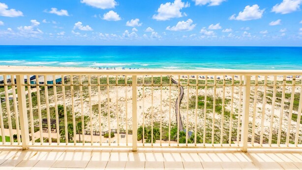 A balcony with a view of a beach and ocean. - Corner Unit A1110 Kng/Qn/Bunk/Sofa Sleeper Direct Gulf View-WIFI - Sleeps 9 (Gulf Shores)