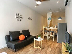 Room, 2 Bedrooms | Living room | Flat-screen TV