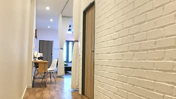 Studio, 2 Bedrooms | Desk, blackout drapes, iron/ironing board, free WiFi